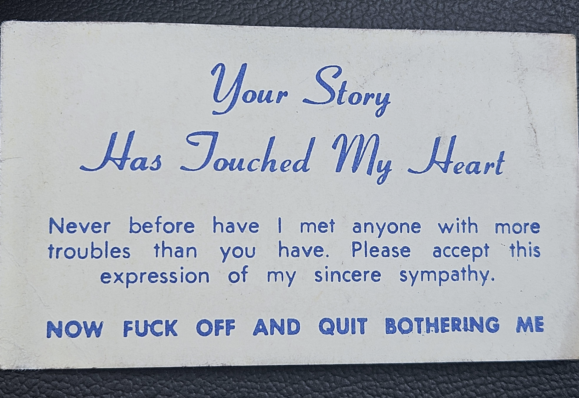 Card with sarcastic message expressing sympathy followed by a rude directive