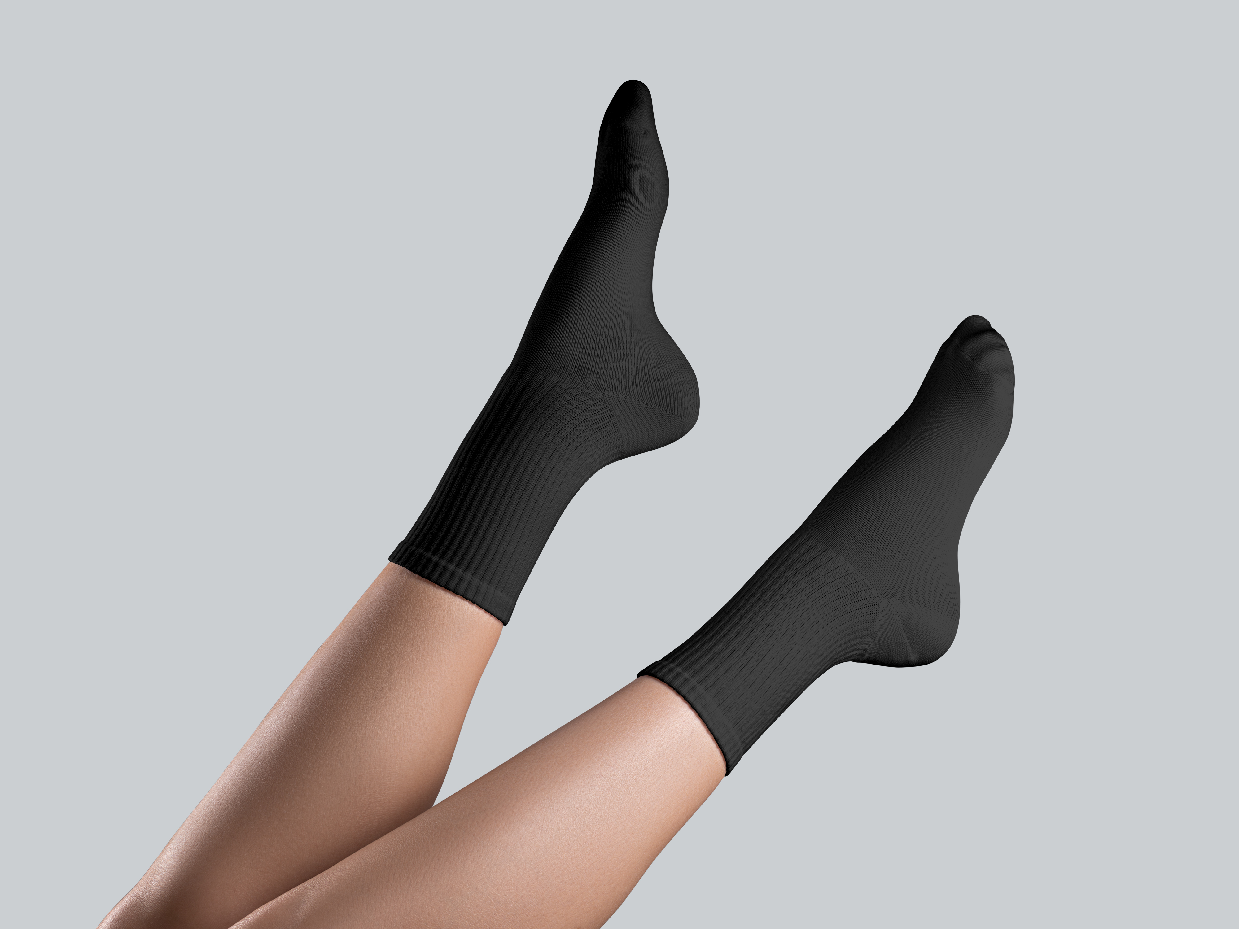 Feet clad in black socks