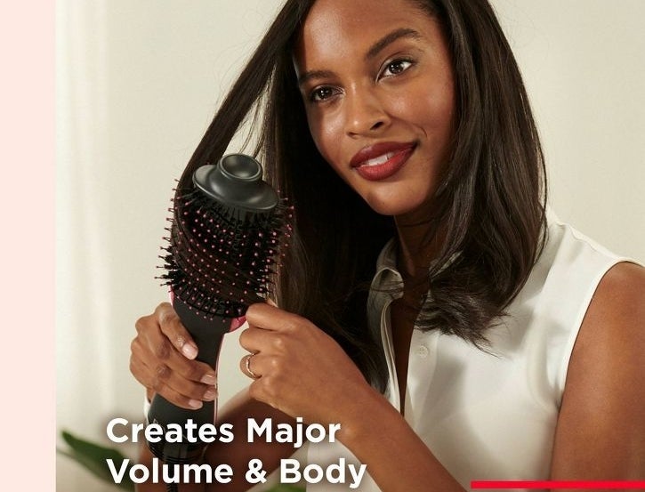 Model styling hair with an oval barrel hairbrush; text highlights "Creates Major Volume &amp; Body, 2.8'' Oval Barrel"