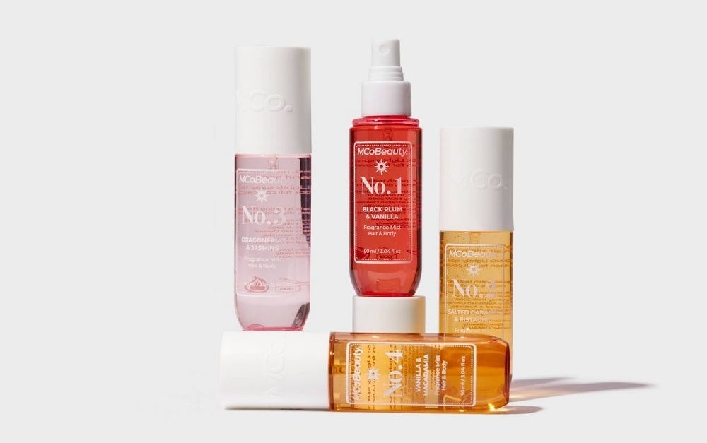 Skincare product set featuring MCoBeauty serums and sprays, with minimalist packaging