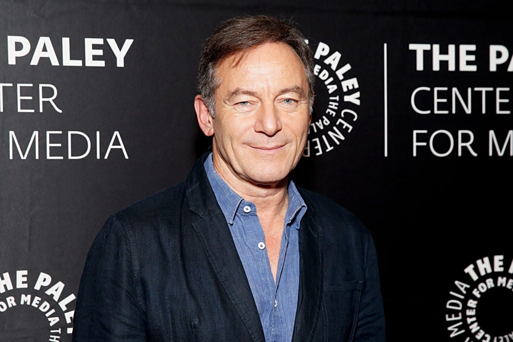 Person at an event wearing a dark blazer over a light shirt. Background displays "The Paley Center for Media" signage