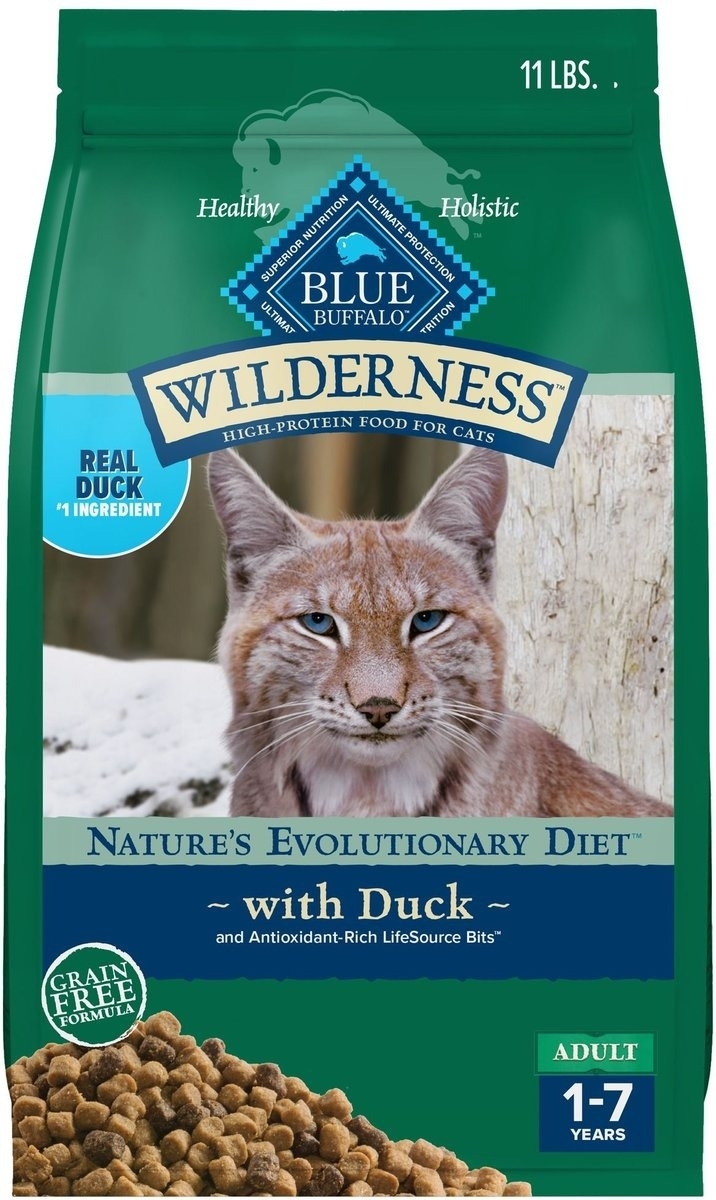 Cat food bag featuring lynx, labeled "Blue Buffalo Wilderness." Describes duck flavor, grain-free formula, for adult cats aged 1-7