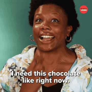Smiling person excitedly says, &quot;I need this chocolate like right now,&quot; with joyful expression
