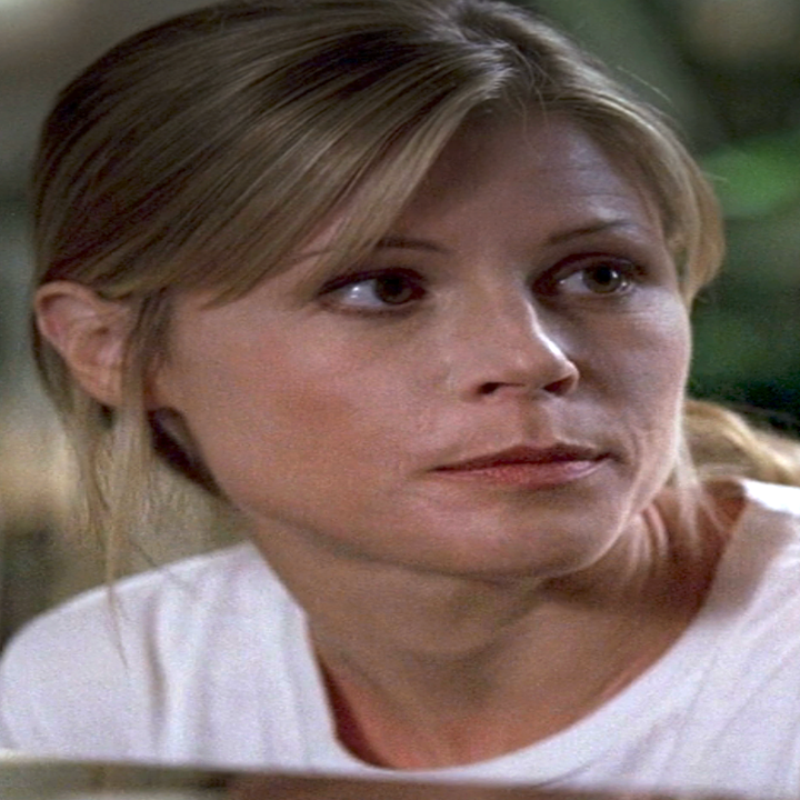 Julie as Sarah in Lost with a thoughtful expression looking to the side, wearing a white shirt