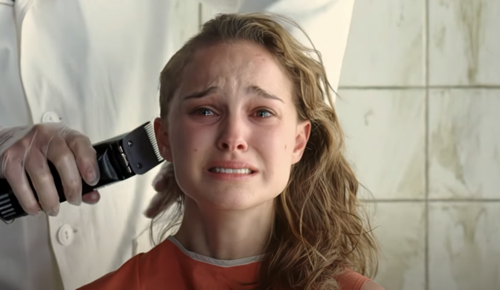 Portman's head being shaved as she cries