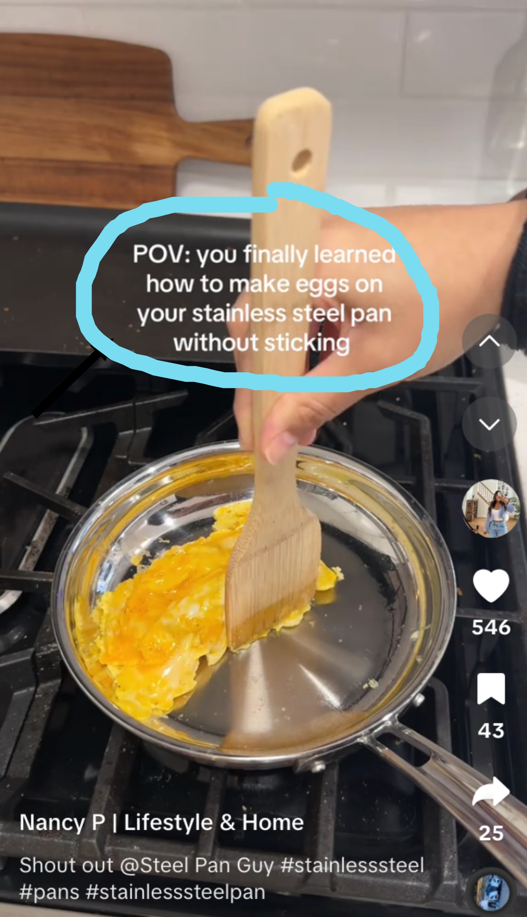 Hand holding a spatula, cooking eggs in a stainless steel pan. Text reads: &quot;POV: you finally learned how to make eggs on your stainless steel pan without sticking.&quot;