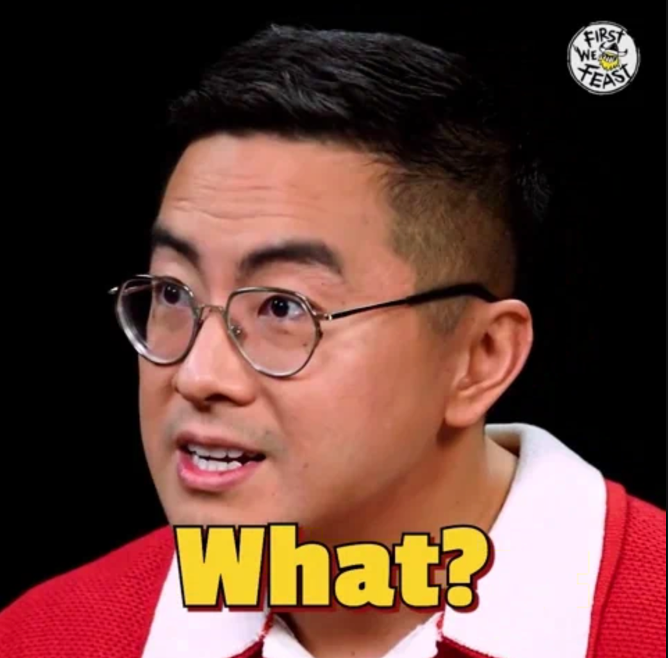 Person with glasses looks surprised, text overlay reads "What?," image labeled with "First We Feast" logo in corner