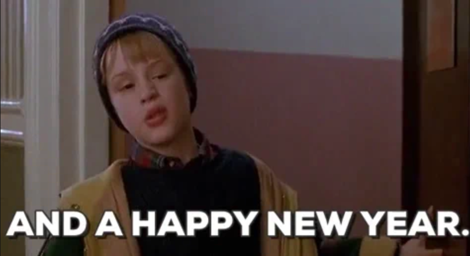 Child wearing a winter hat, looking relaxed, with text overlay: "AND A HAPPY NEW YEAR." Scene reminiscent of holiday movie moments