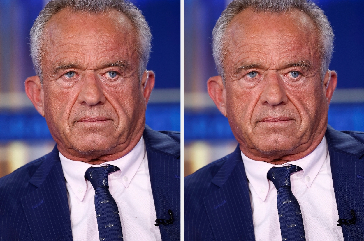 Man in a suit and tie with a serious expression, facing the camera. The image is likely from a formal event or interview setting