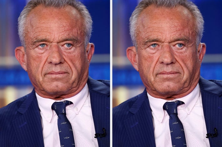 Man in a suit and tie with a serious expression, facing the camera. The image is likely from a formal event or interview setting