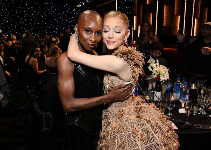 Cynthia Erivo and Ariana Grande hugging at an event