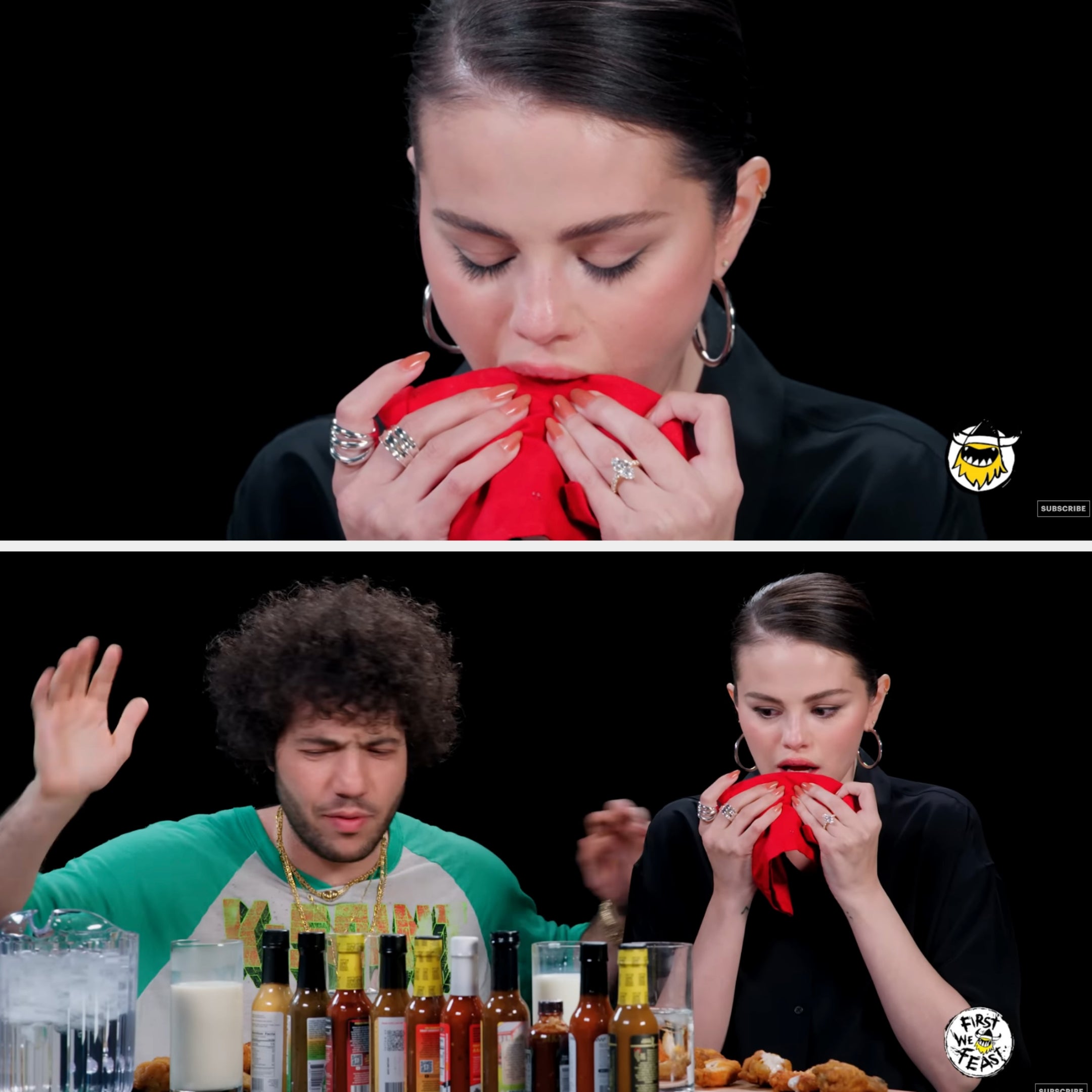 Two people try hot sauces on a talk show. One wipes their mouth with a napkin, looking pained. Multiple hot sauces are on the table
