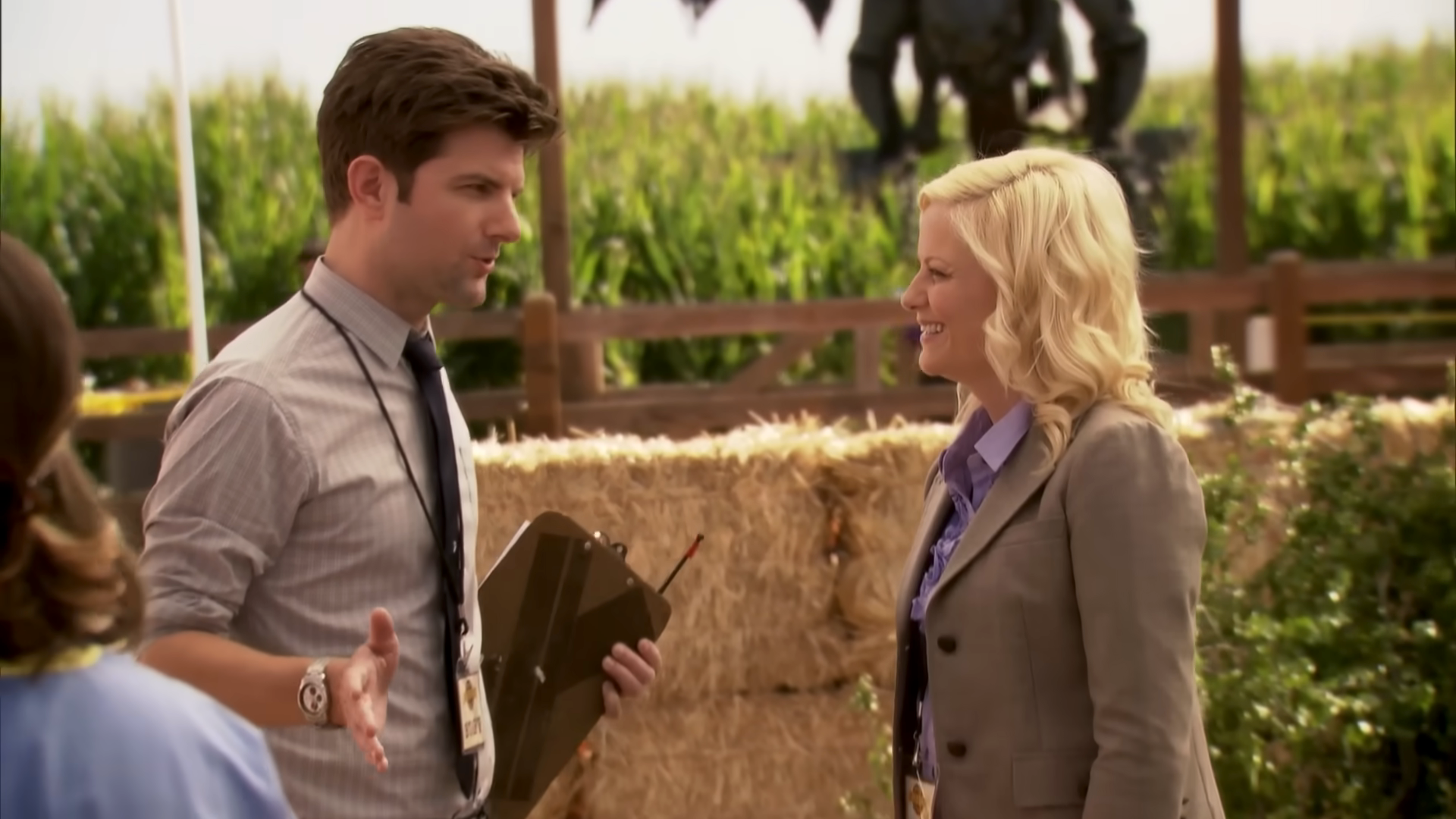 Amy Poehler and Adam Scott and Ben and Leslie in "Parks and Rec" talking outside