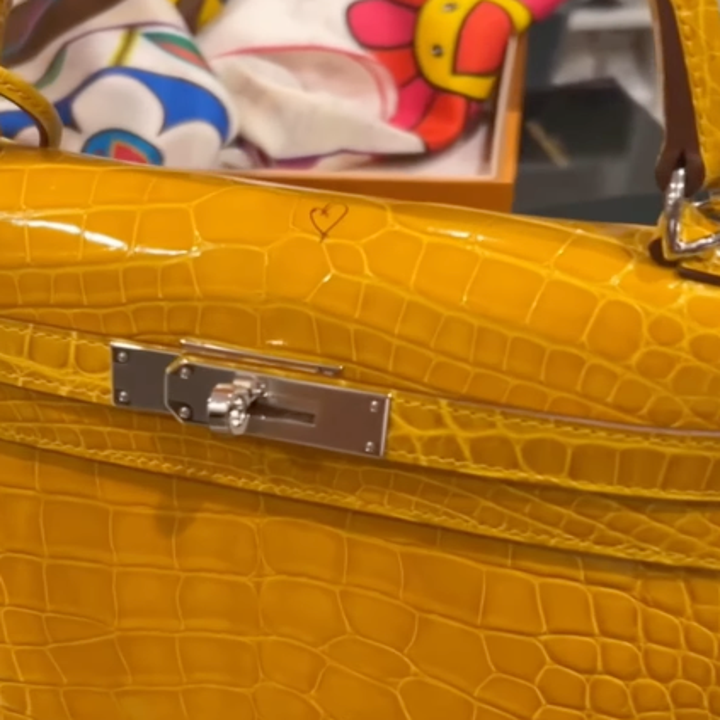 Zoom in on Cardi's Birkin, showing a little heart drawn on the top in ballpoint pen, no bigger than a fingernail