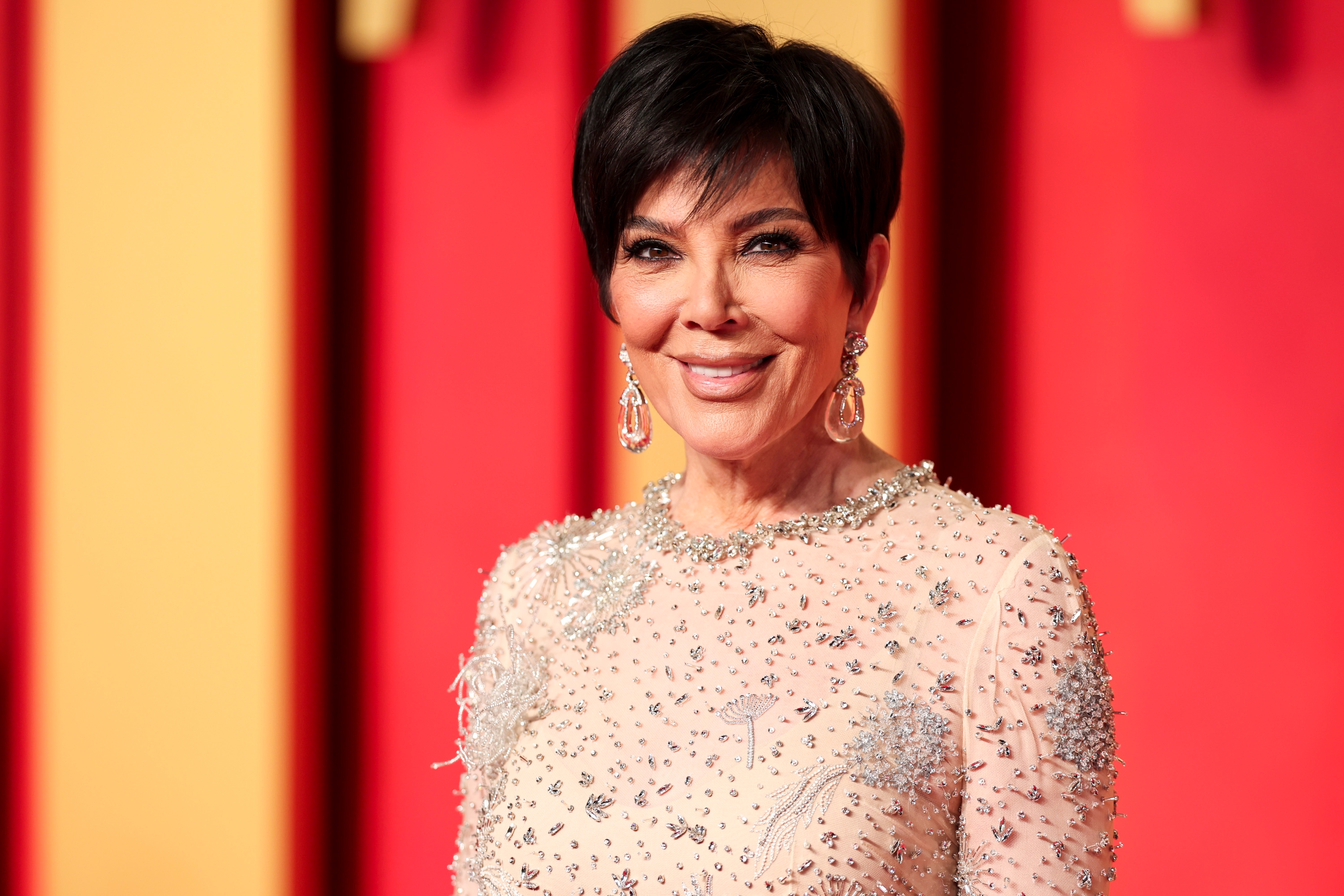 Kris Jenner posing on a red carpet