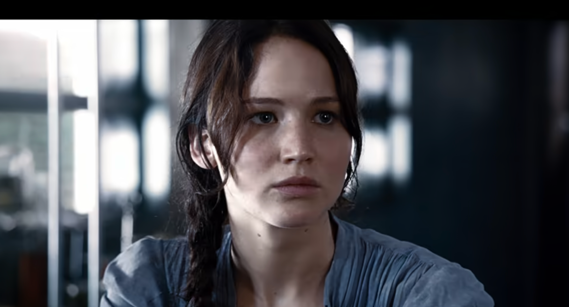 Katniss stares intently in a still from a dramatic scene