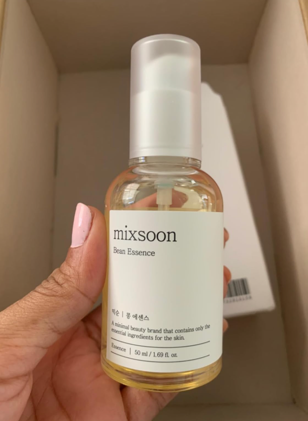 Person holding a vessel  of Mixsoon Bean Essence