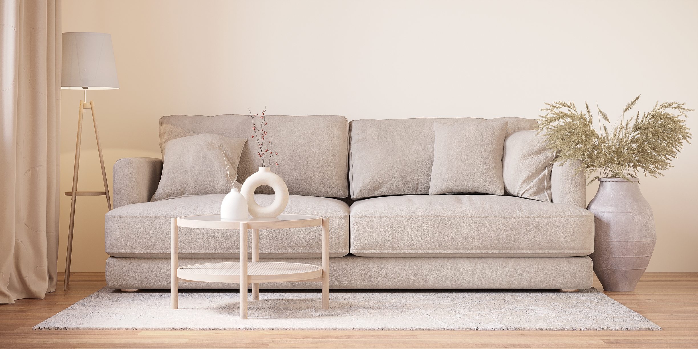 Minimalistisk stue med en beige sofa, rundt bord, dekorativ vase og gulvlampe på et lett teppe