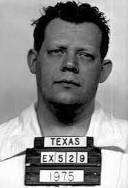 A vintage mugshot of an unidentified antheral successful a plain garment from 1975, holding a committee labeled "Texas EX 529"