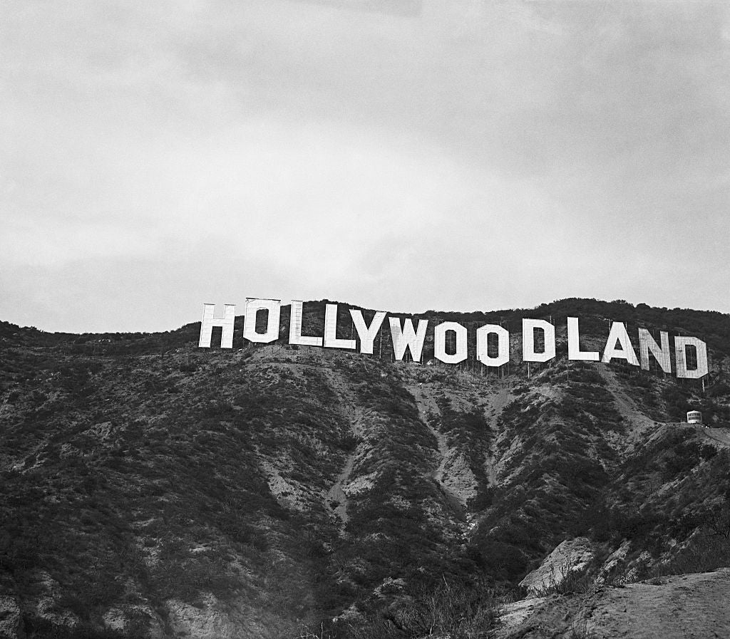 Historic Hollywoodland motion   connected  a hillside, classical  1920s style, surrounded by vegetation