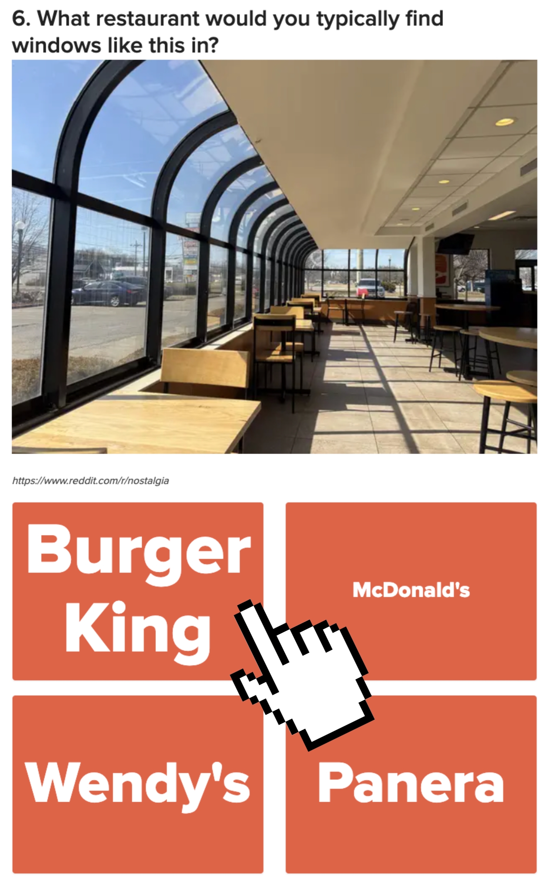 A sunlit restaurant interior with large windows and wooden seating, asking which restaurant (Burger King, McDonald's, Wendy's, Panera) has such windows