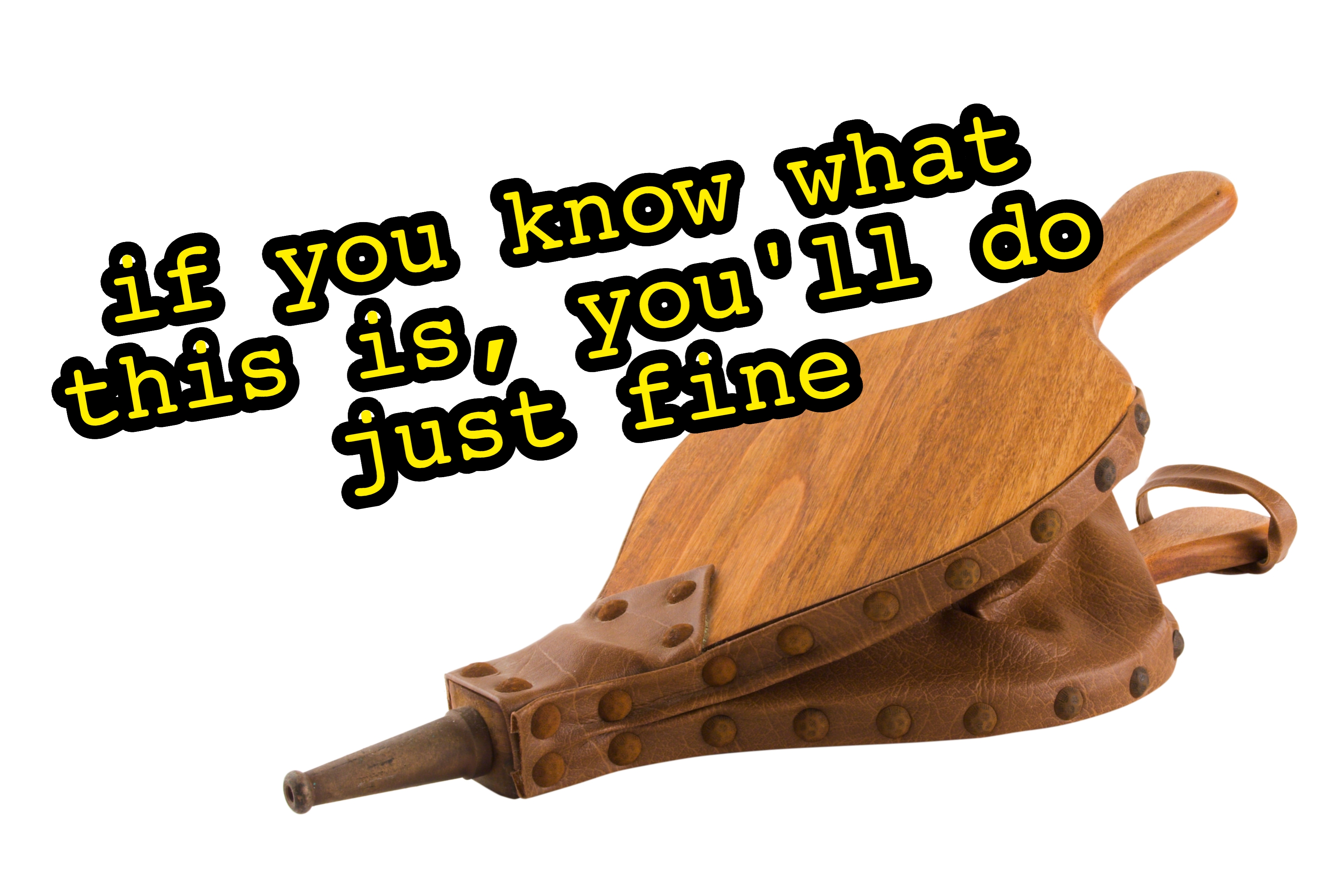 A wooden fireplace bellows with a leather trim and a metal nozzle