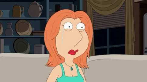 Animated character with red hair and a turquoise top appears surprised or concerned, sitting on a couch in a living room setting