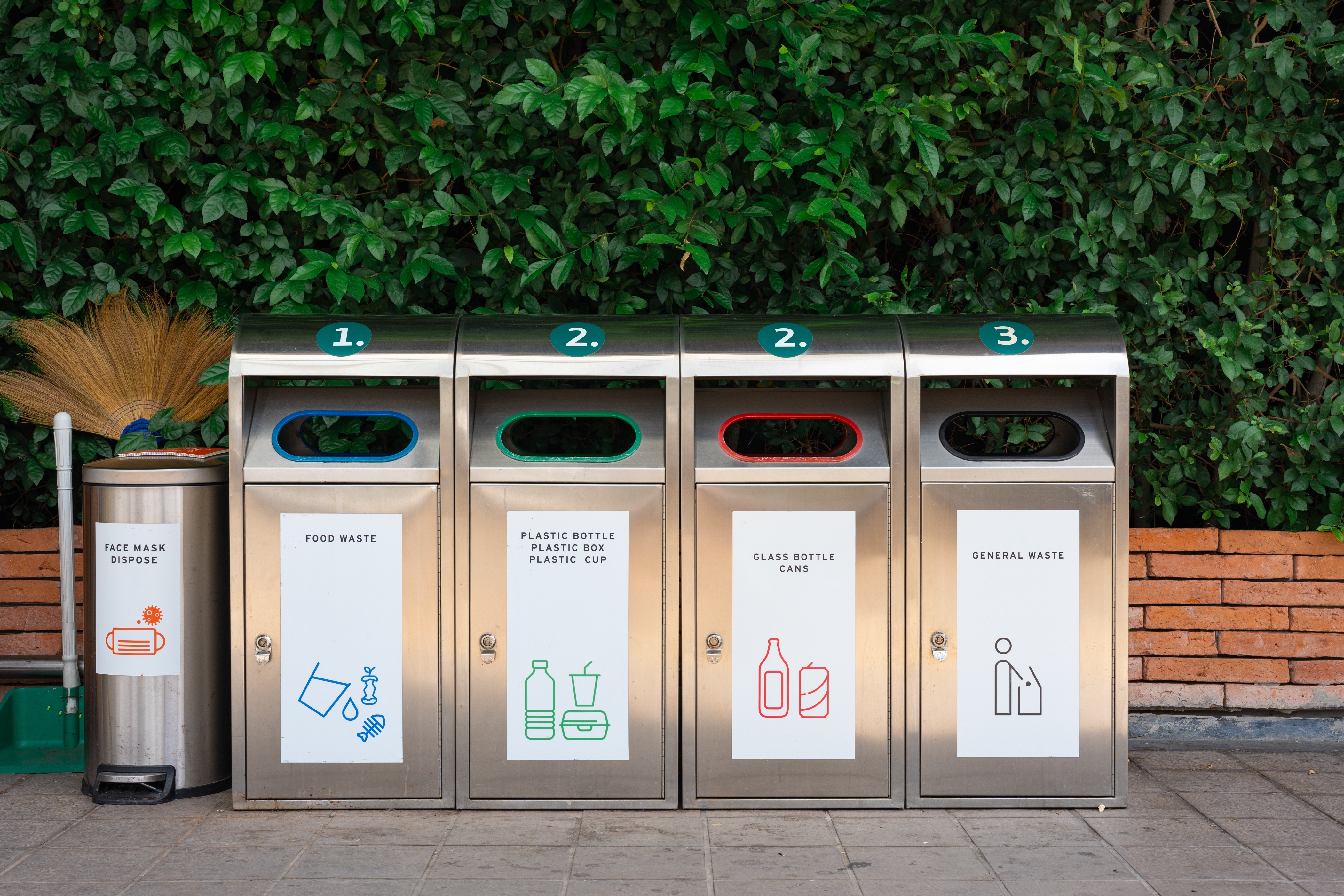 Different trash and recycling bins.