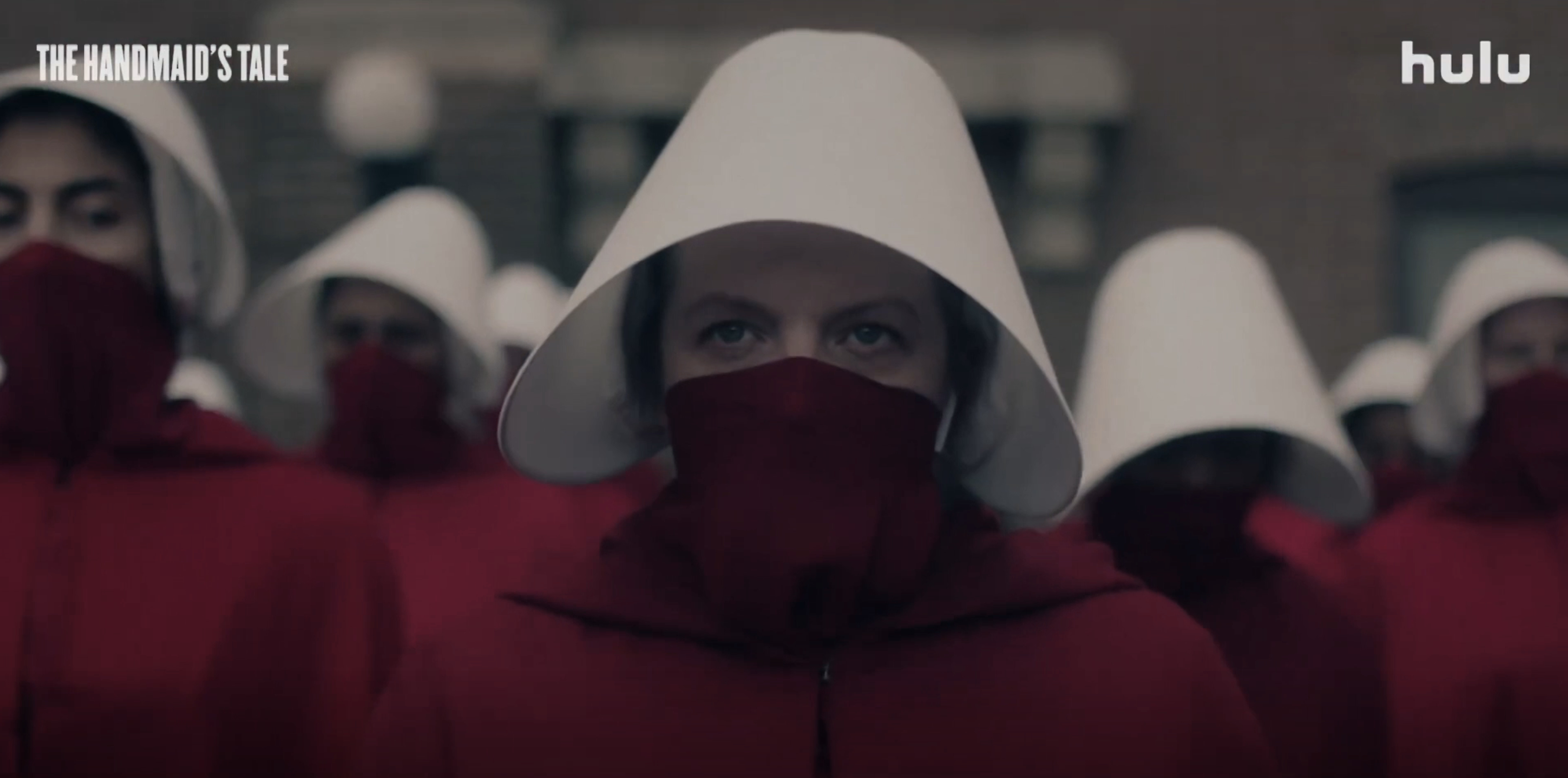 Scene from &quot;The Handmaid's Tale,&quot; featuring a crowd of women in white bonnets and red cloaks