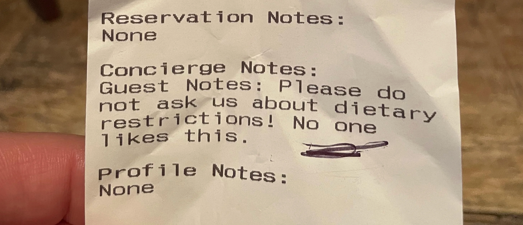 Note on a receipt requests not to ask about dietary restrictions, stating it is disliked