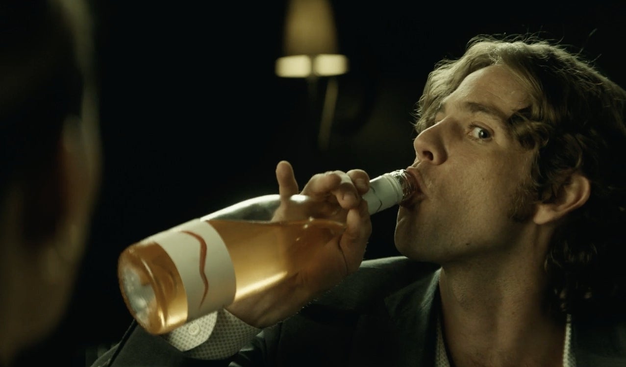Kyle drinking a bottle of rosé in "F Marry Kill."