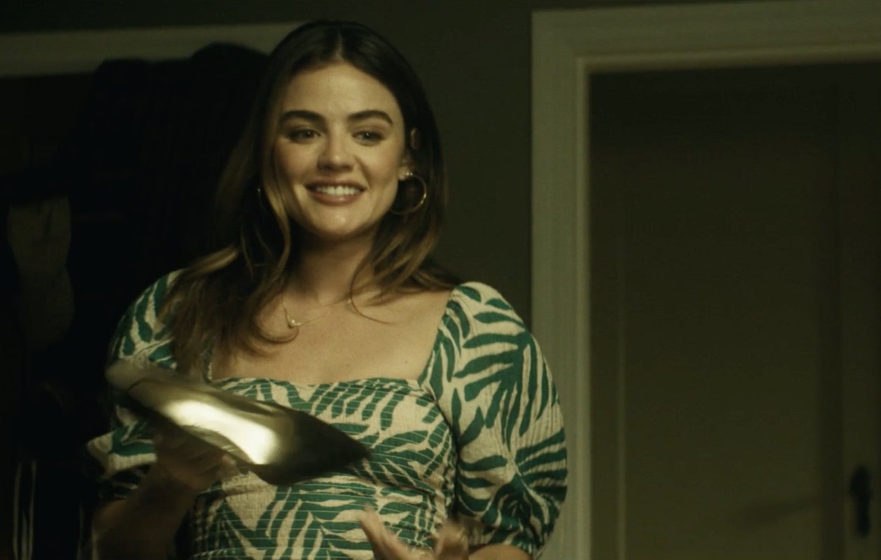 Lucy Hale holding a high heel in "F Marry Kill."