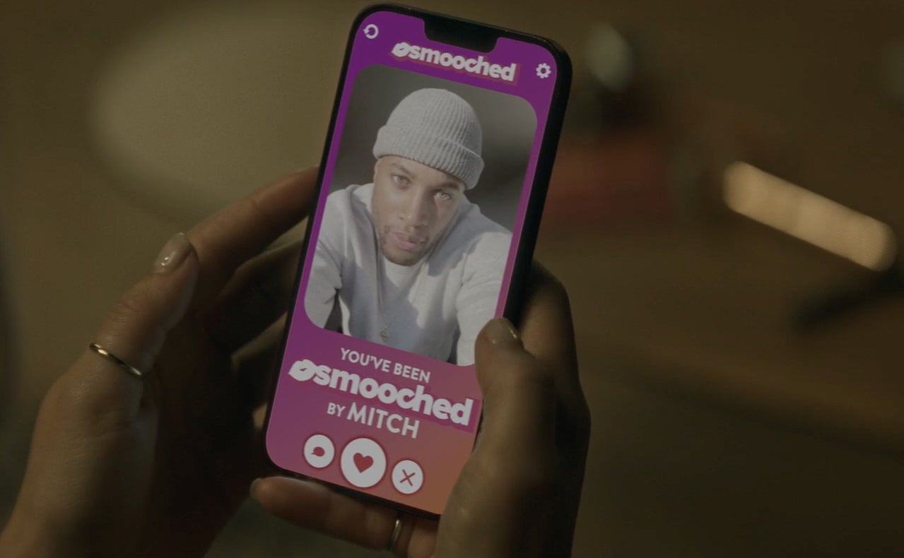 Mitch's dating profile on a phone screen in "F Marry Kill."