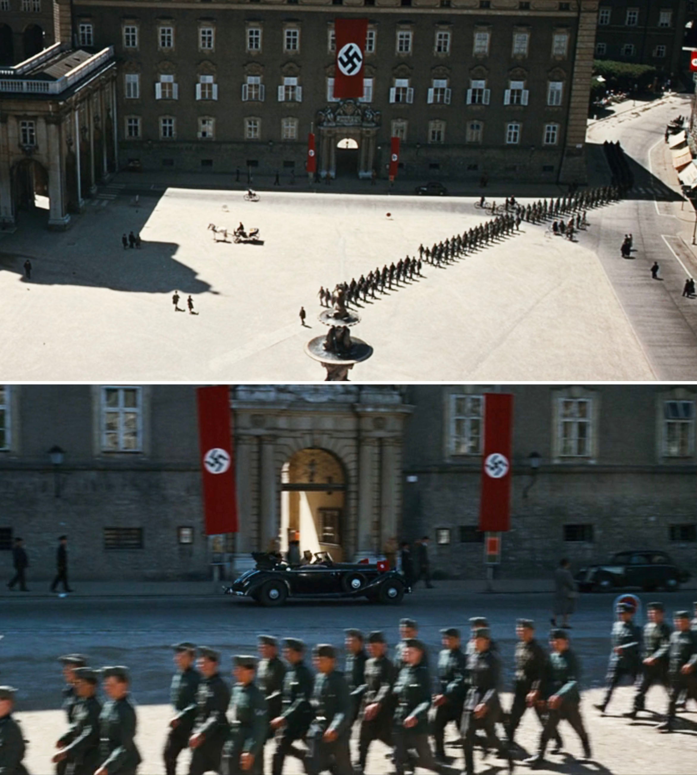 A scene from a historical movie depicting Nazi soldiers marching in formation in a large courtyard with Nazi banners