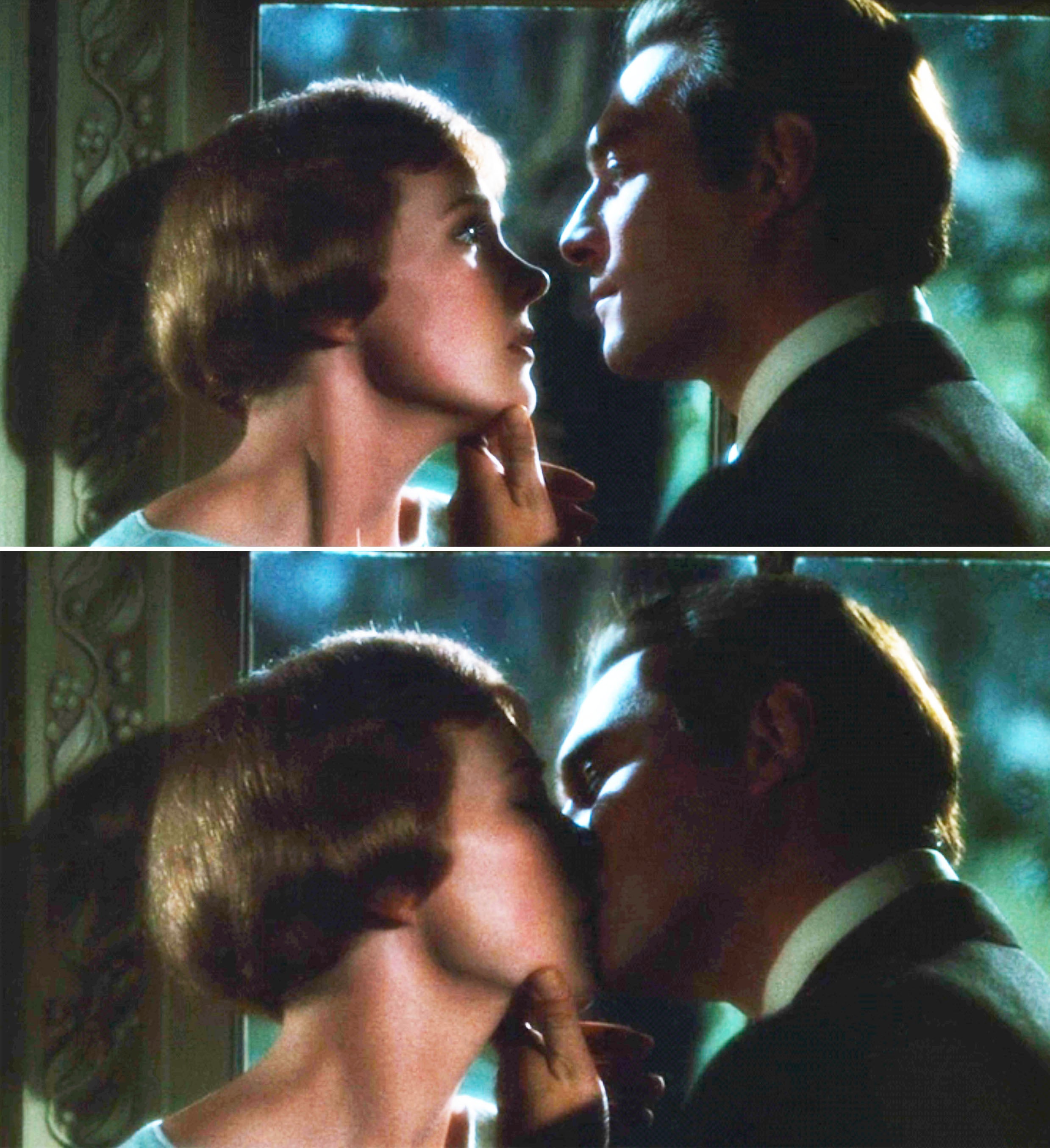 The Captain and Maria kissing in a dimly lit setting