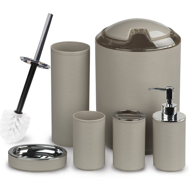 Bathroom accessory set with a waste bin, toilet brush, soap dispenser, toothbrush holder, cup, and soap dish, all in a ribbed texture