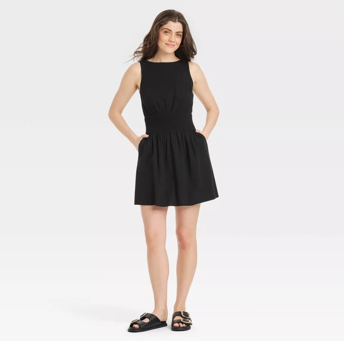 a person wearing the black mini sundress