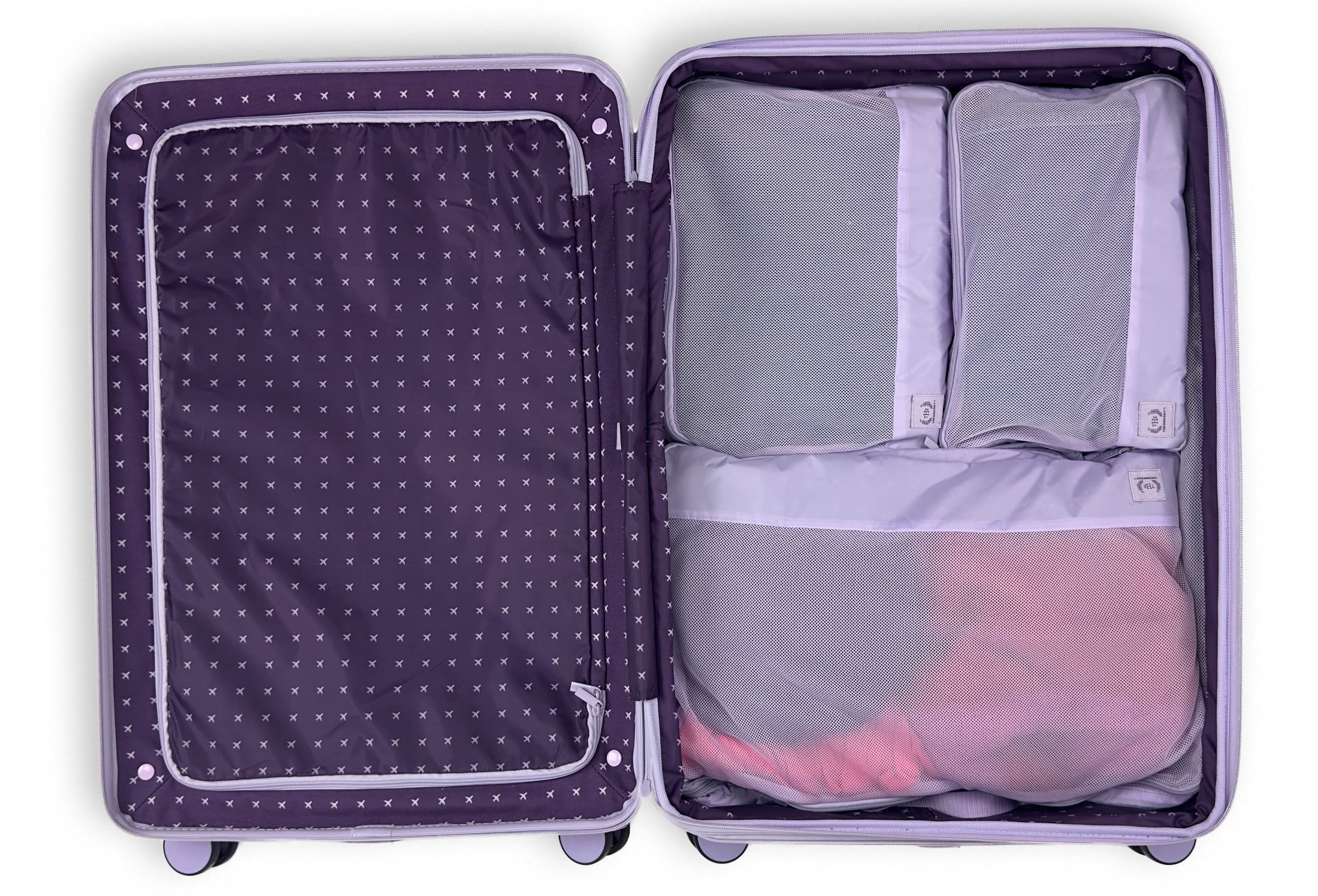 Open suitcase with neatly packed clothing in mesh organizers