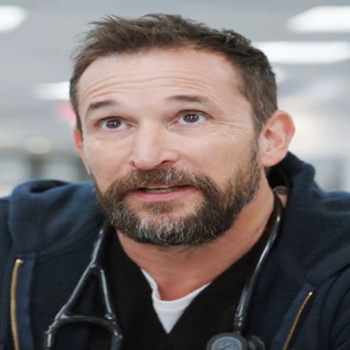 Noah as Dr. Robby wearing a sweatshirt and stethoscope looking up