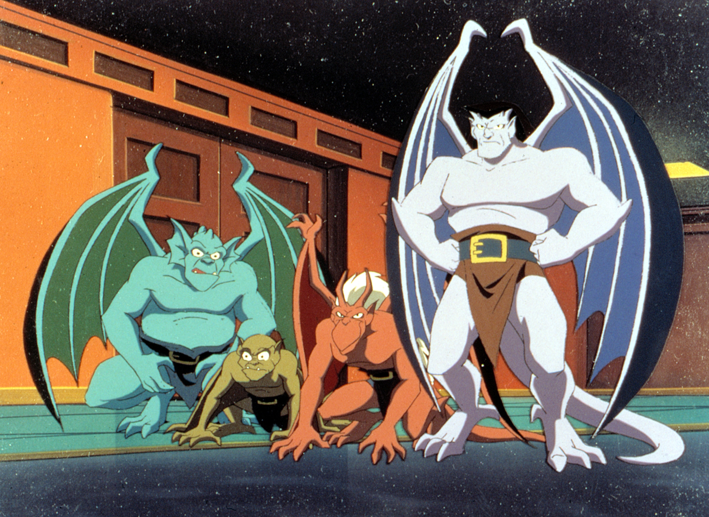 Animated gargoyles in a group pose, showcasing a variety of expressions and wing styles, from a classic animated TV series