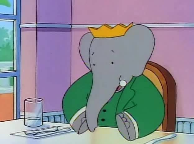 Animated elephant in a crown and green coat sits at a dining table with a glass and silverware, appearing thoughtful