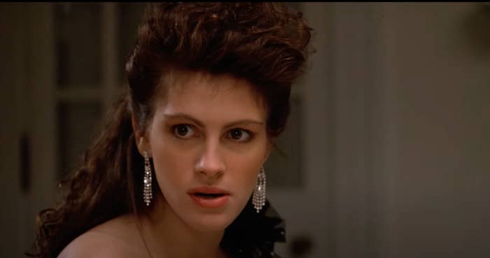 Julia Roberts with a surprised expression and dangling earrings in "Mystic Pizza"