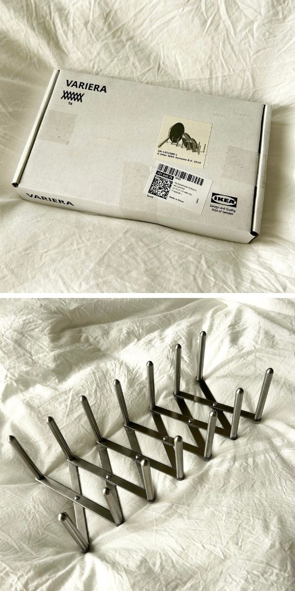 イケアのVARIERA製品の箱と、中の折りたたみ式メタルラックが白い布の上に置かれている。