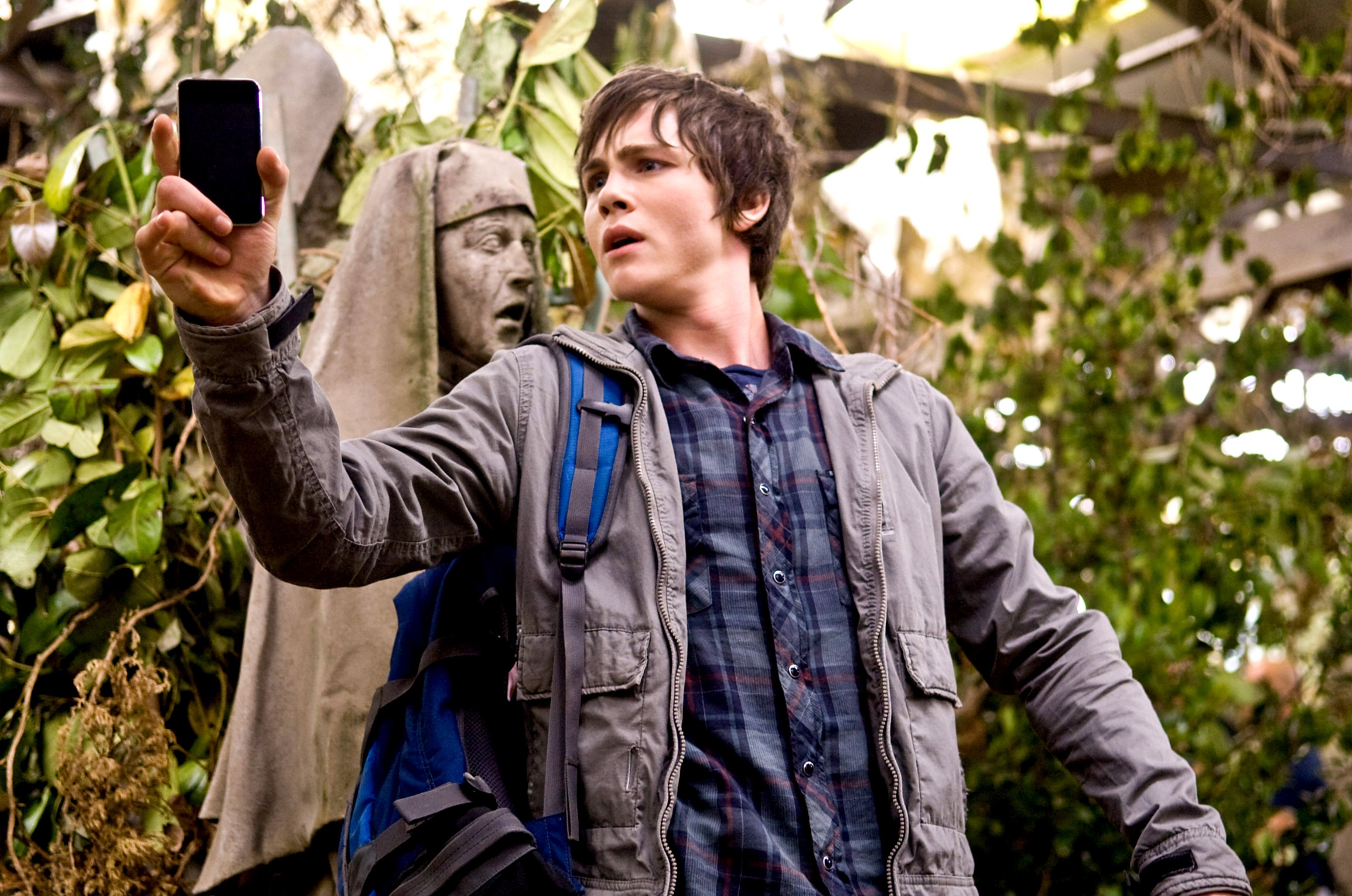 Logan Lerman as Percy Jackson in "The Lightning Thief" using his iPod to spot Medusa