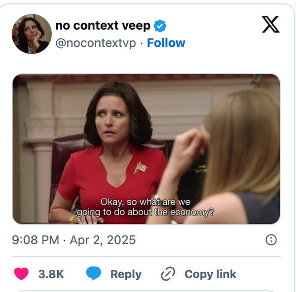 A woman in a red top asks, "Okay, so what are we going to do about the economy?" while sitting at a table with another person