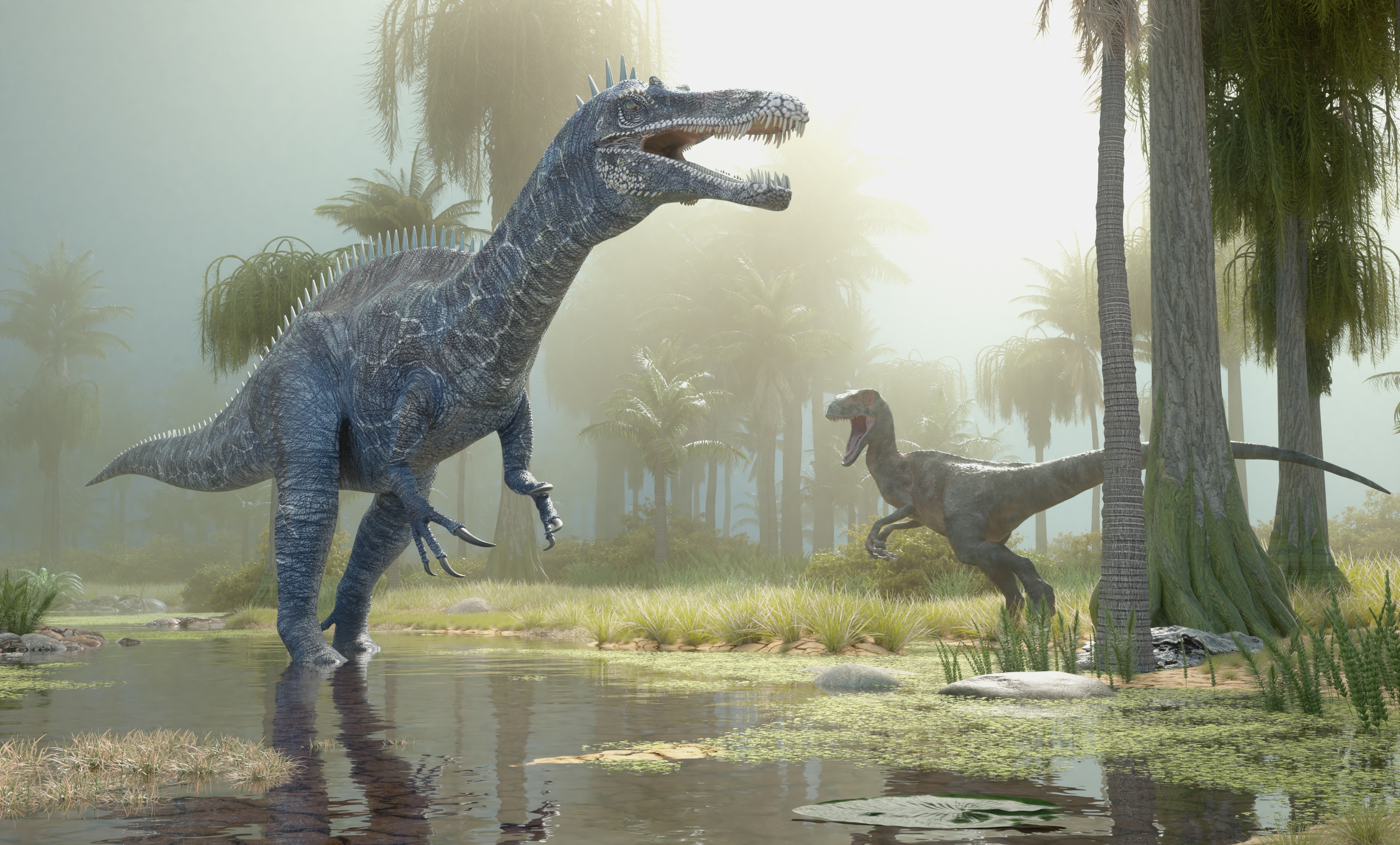 Two dinosaurs, one larger and one smaller, stand in a lush prehistoric forest with mist and tall trees in the background