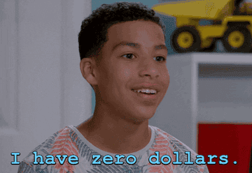 Teen smiling and saying, "I have zero dollars," conveying a humorous take on personal finance