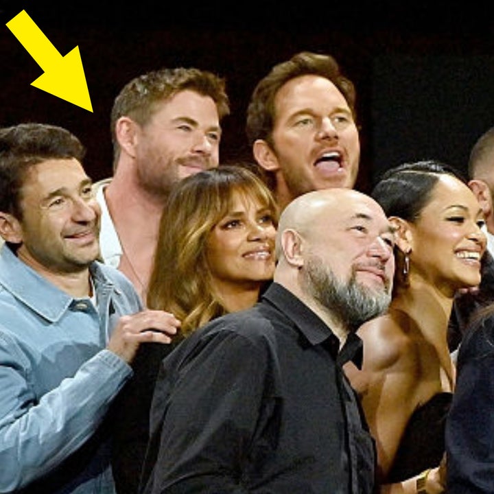 Group of people smiling and posing together at an event; varies from formal to casual attire