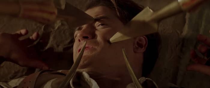 Brendan Fraser is prodded by the tips of various weapons in a scene from &quot;The Mummy&quot;