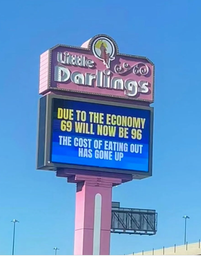 Billboard reads: "Due to the economy, 69 will now be 96. The cost of eating out has gone up."